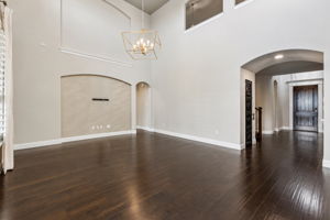 Freshly recoated hardwoods, a designer chandelier and Serena & Lily grasscloth detailing