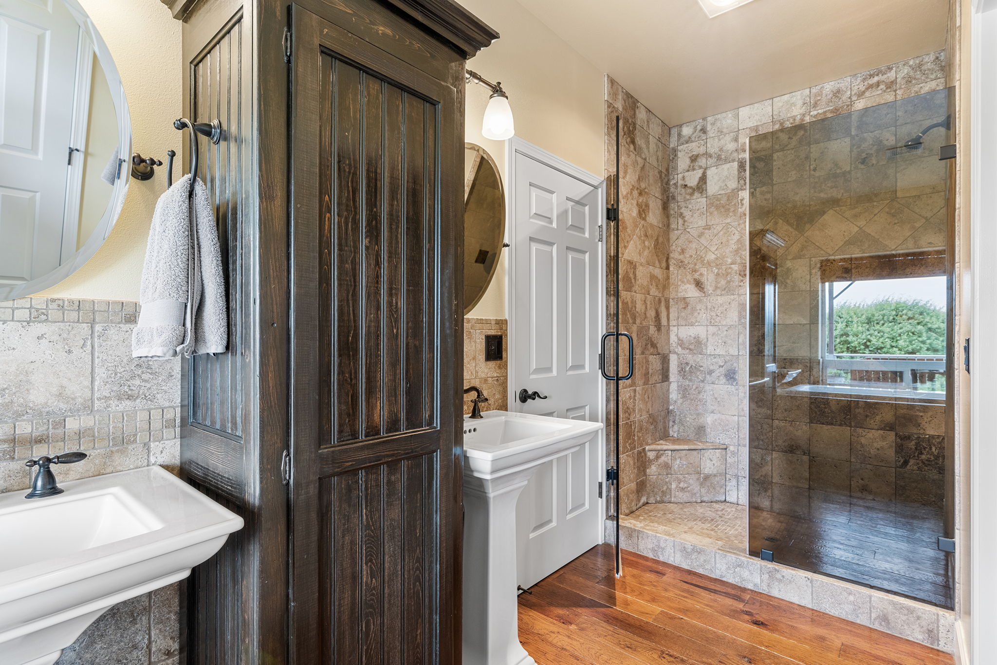 Main-Level Primary Bathroom with Double Vanities and Large Walk-In Shower