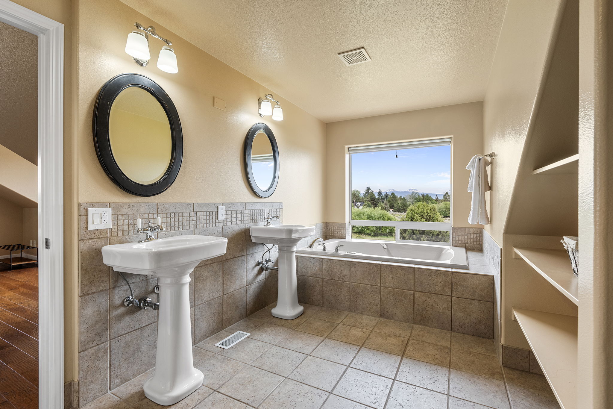 Upstairs Primary Bathroom with Double Vanities and Jetted Tub with Cascade Mountain Views