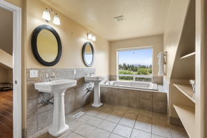Upstairs Primary Bathroom with Double Vanities and Jetted Tub with Cascade Mountain Views