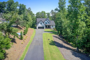 88 Aerial Exterior Front w Driveway + Parking Pad