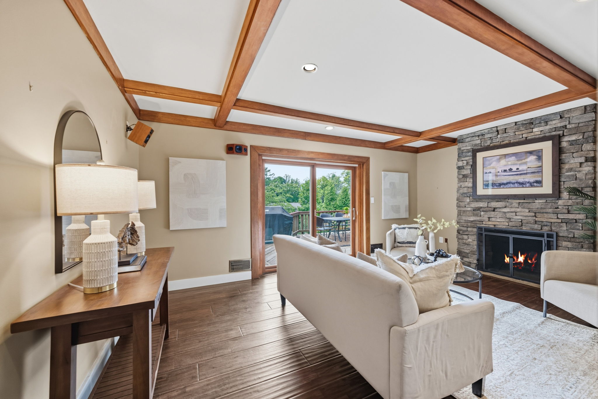 Stone fireplace & beams make for a cozy living