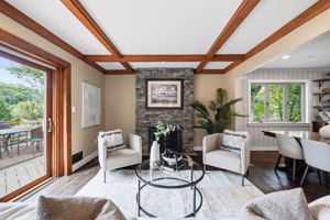 Beautiful stone fireplace centers the living room