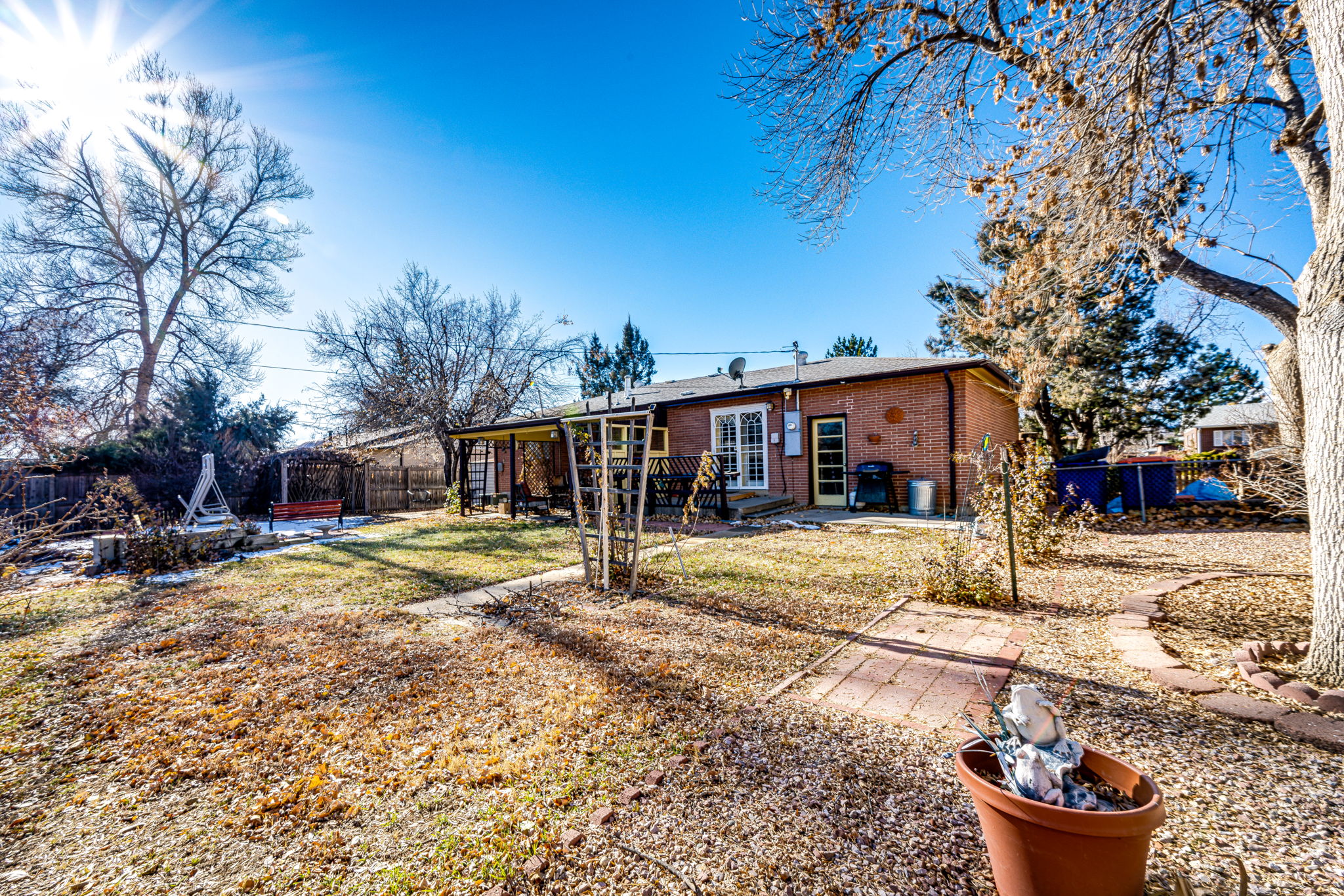 Large backyard with a privacy fence