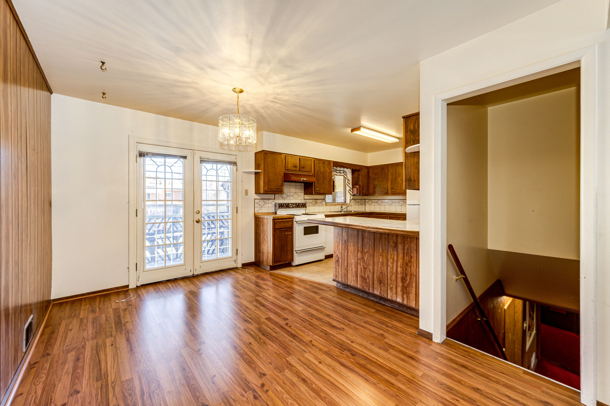 Eat-in space off of the kitchen with patio doors leading out onto the backyard patio area