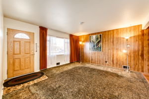 Front living room with beautiful original hardwood floors underneath