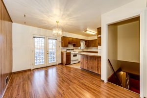 Eat-in space off of the kitchen with patio doors leading out onto the backyard patio area