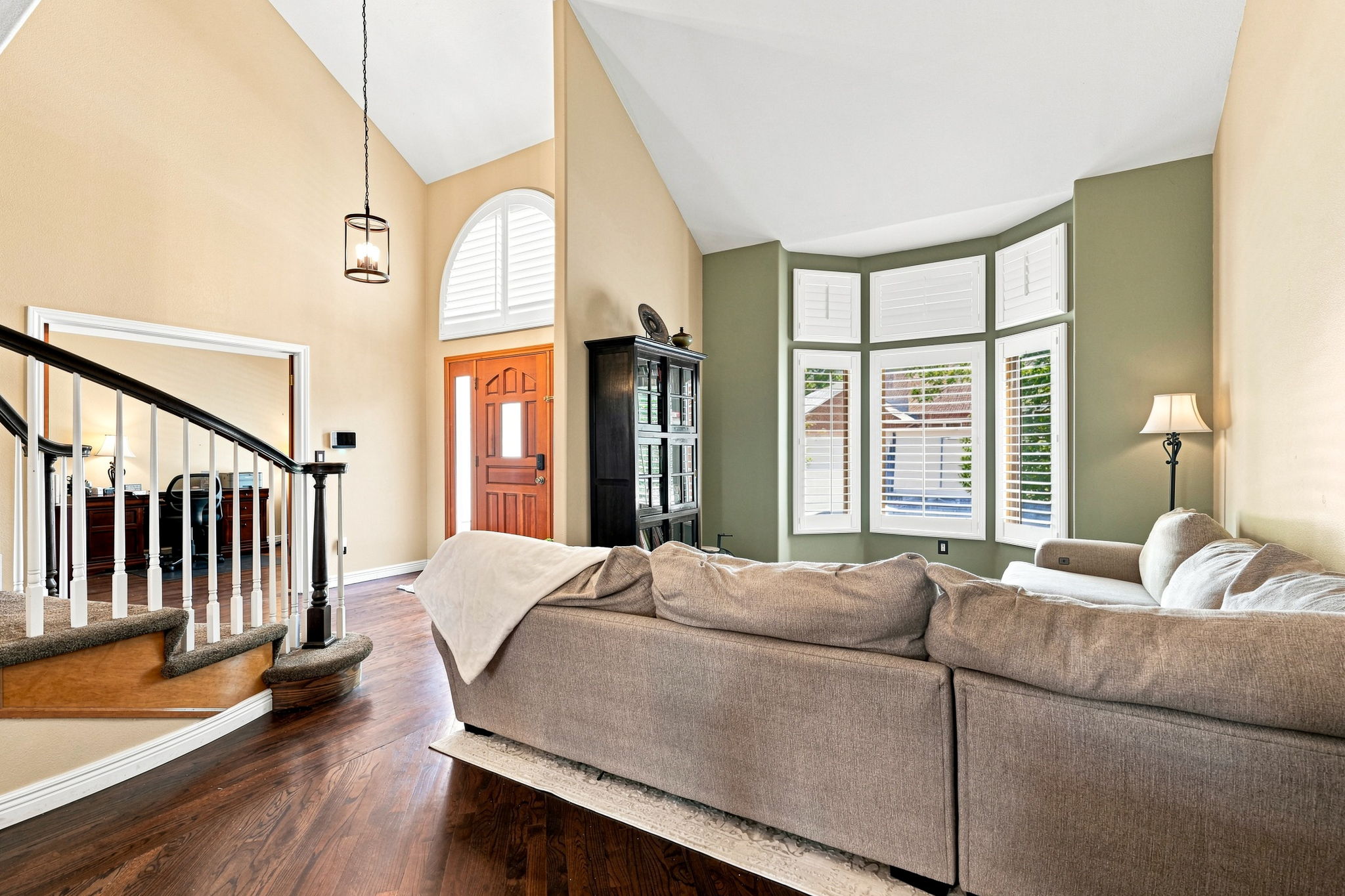 Another view of the formal living room to the foyer and office.