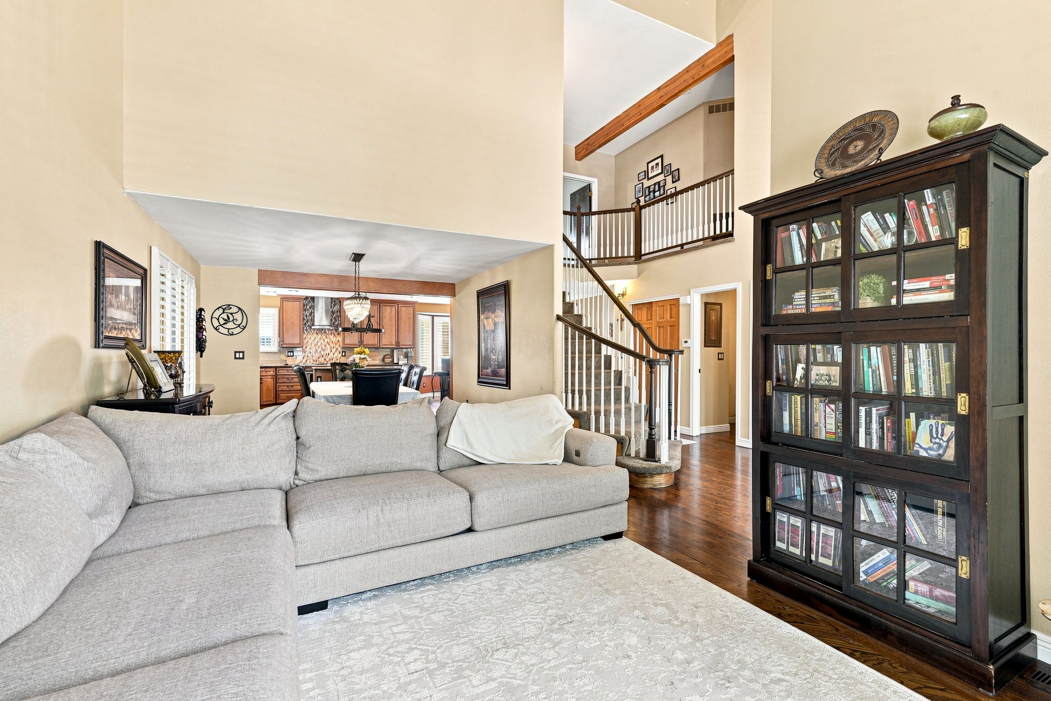 Formal living room opens to dining room, kitchen and foyer.