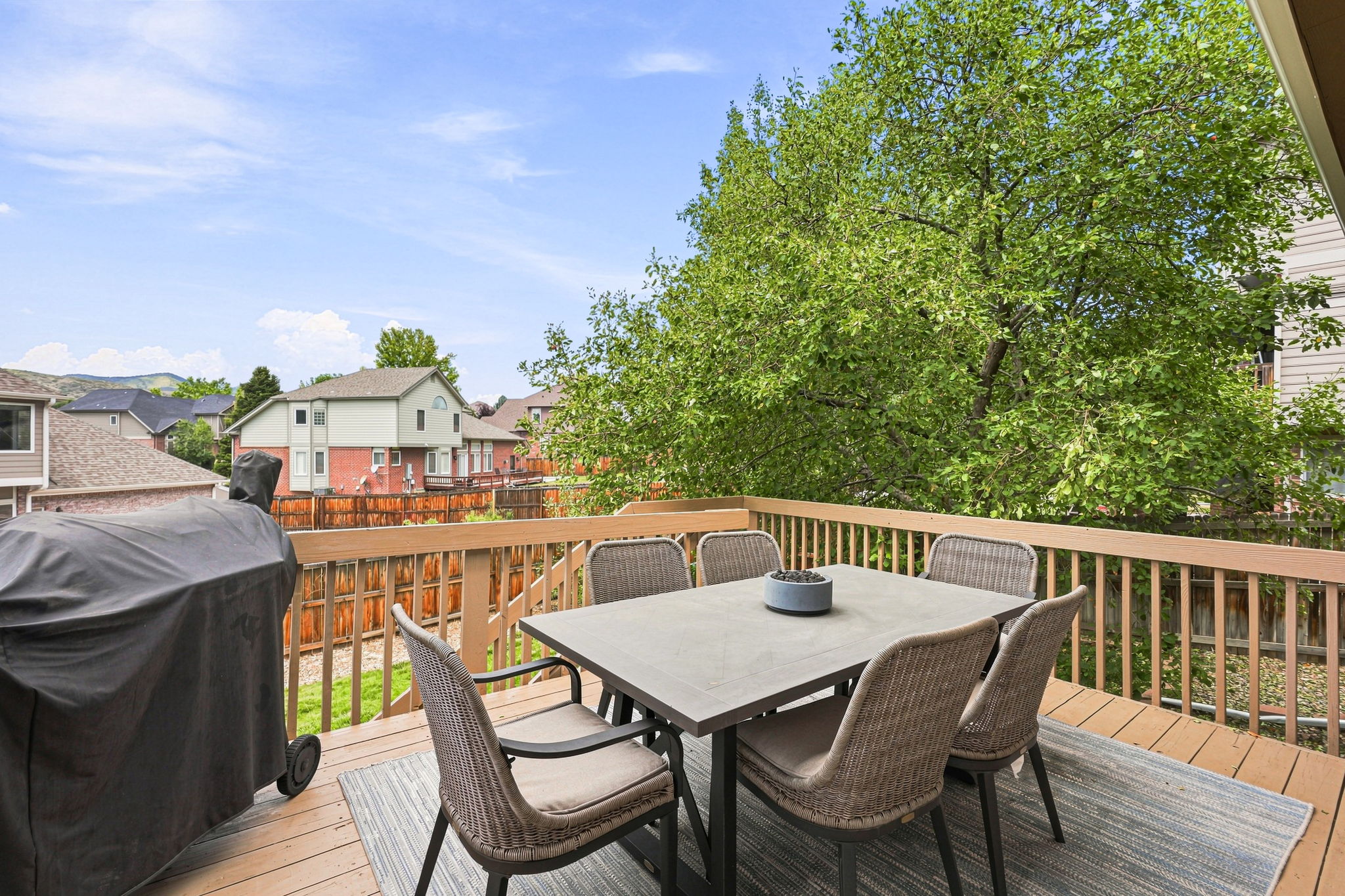 Family room leads out to the deck with wonderful views of foothills and golf course.