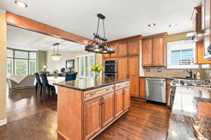 Kitchen, island, granite countertops, stainless steel appliances, microwave oven, wall over, warmer drawer, dishwasher, plantation shutters, gas stove and lots of lighting, cabinets space, soft close drawers and cabinets doors.