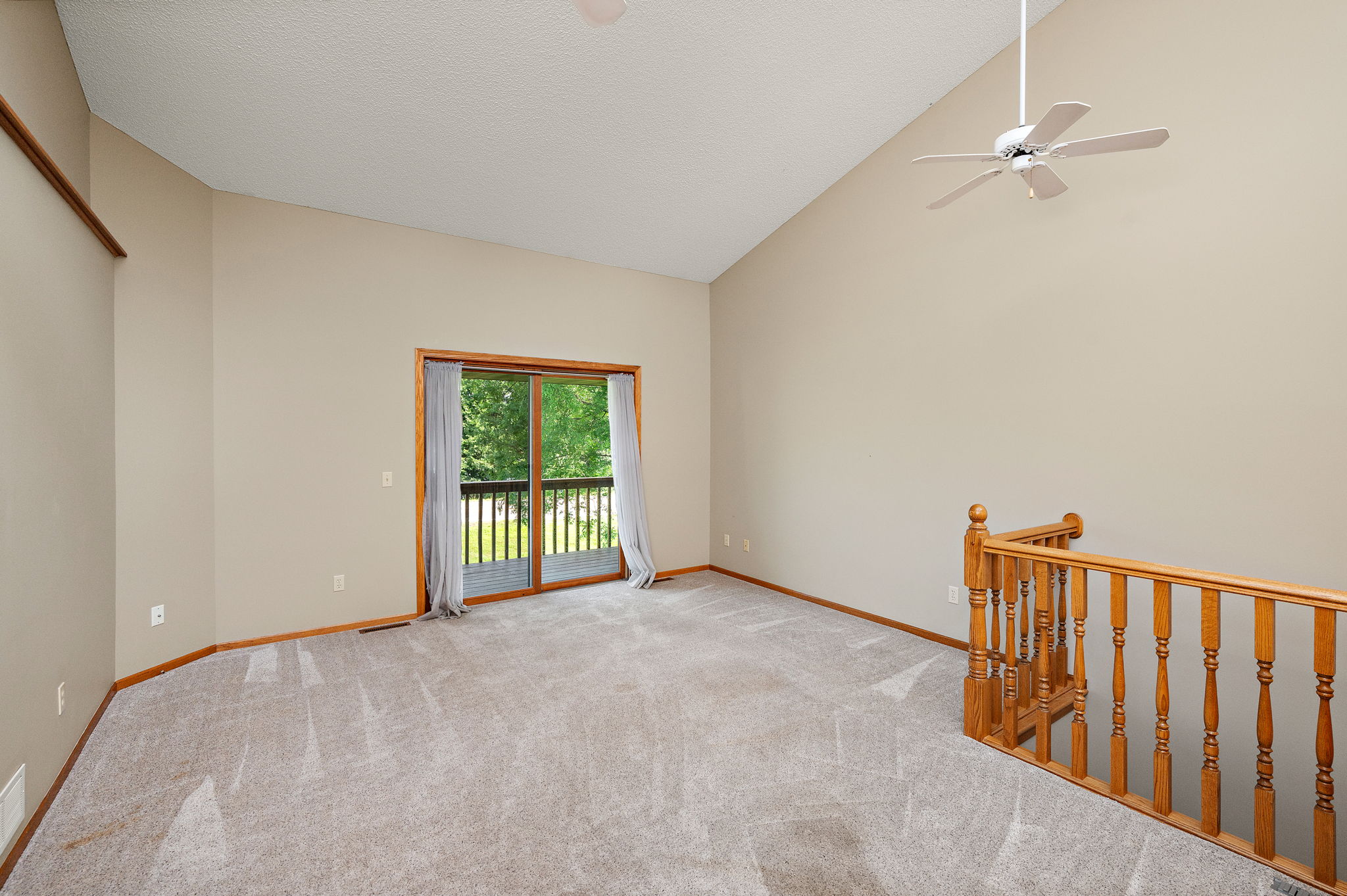 Walk out sliding doors to back deck. Relax and take in the scenery
