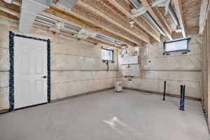 Arrow to the black pipes saying "Bathroom Rough-In"