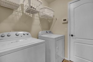 Laundry at the stop of the stairs to basement