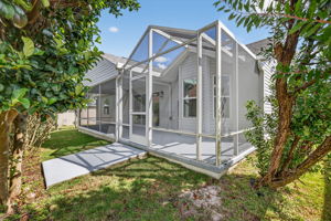 Rear/Side Yard with Lanai and Extended Birdcage