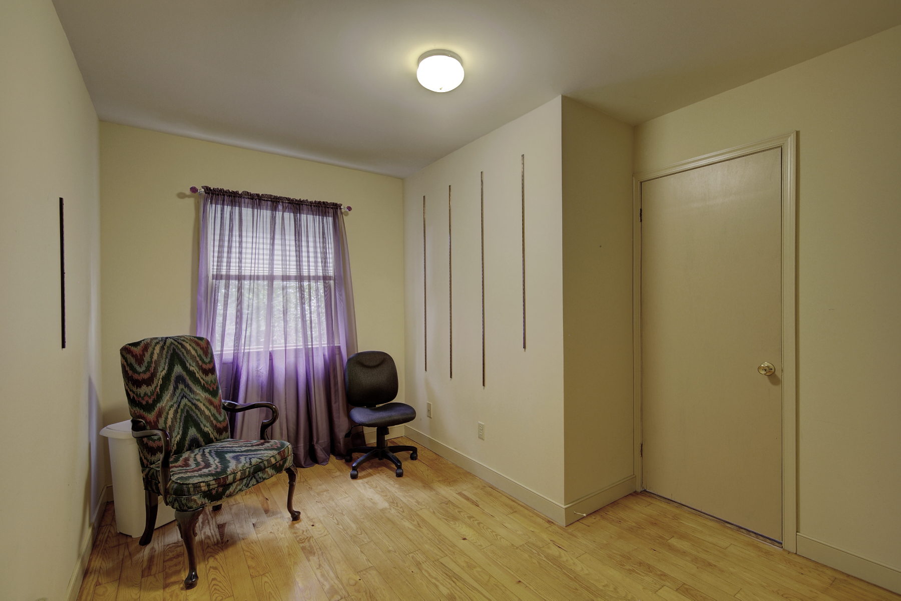 Hobby Room with closet and hardwood floors