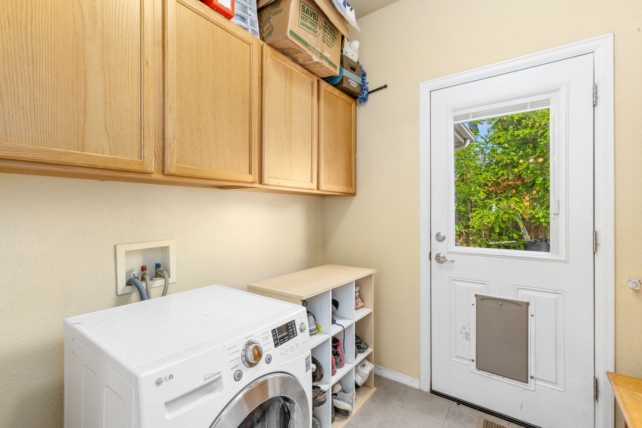 Main floor laundry with combo washer/dryer unit