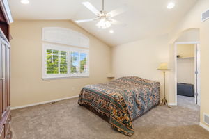 Primary with NEW carpet, vaulted ceilings, walk-in closet, 5-piece bath including soaking tub