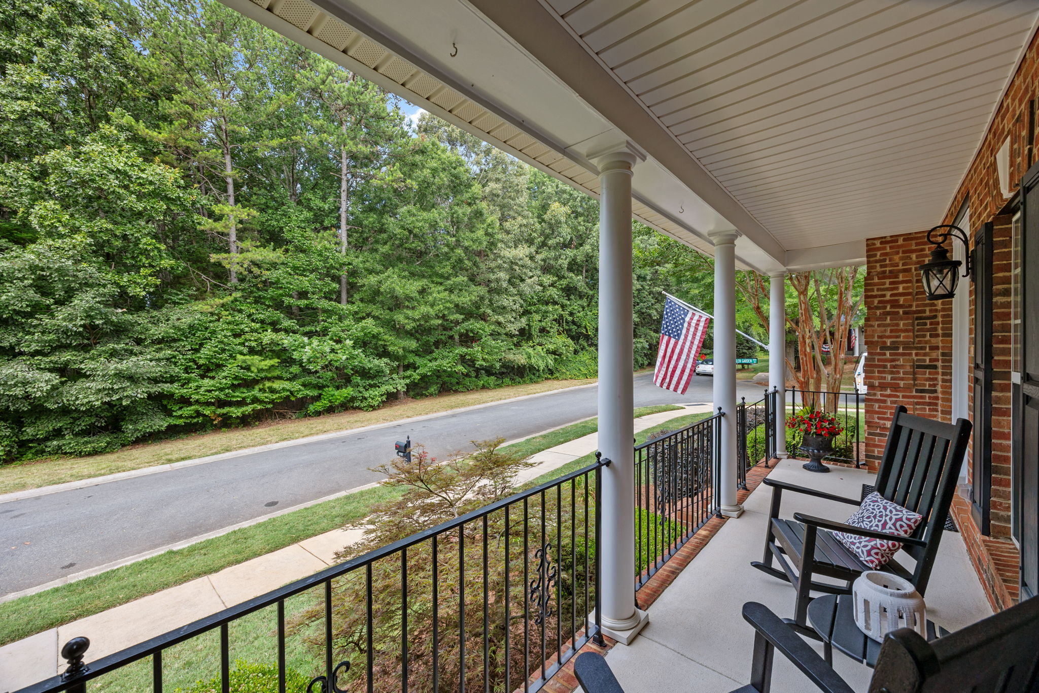Rocking chair front porch overlooks community green space