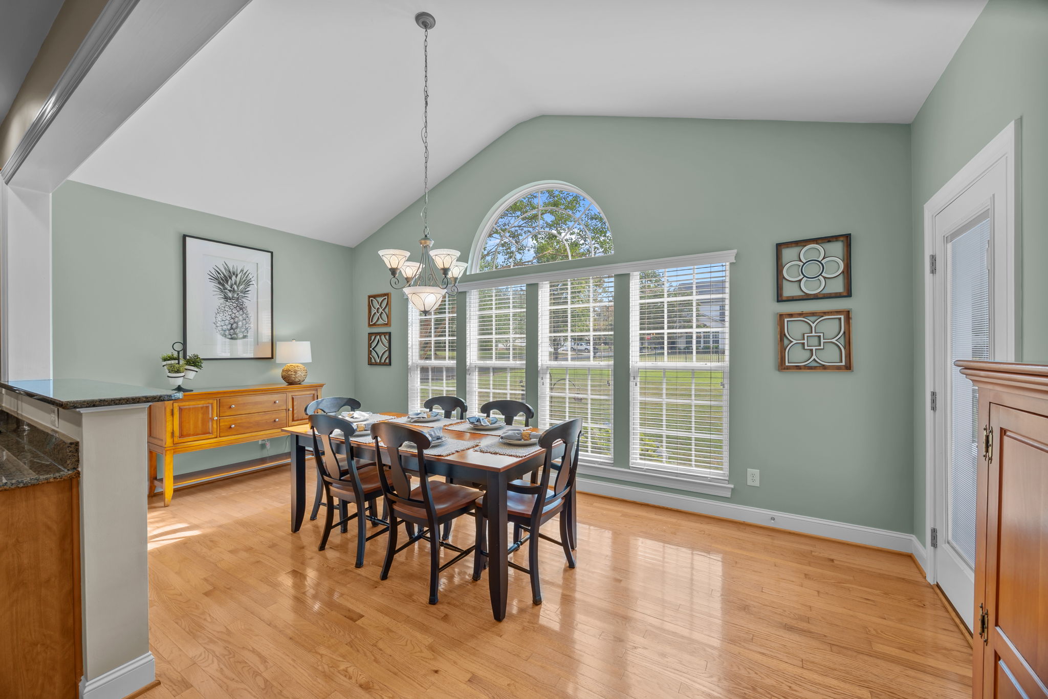 Vaulted sunroom makes a cheery breakfast area