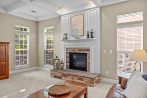 Stone accent at gas log fireplace and nicely done trim work