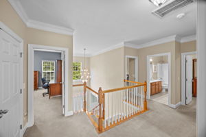 Airy and bright second floor landing with crown molding