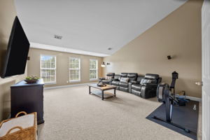 Huge, vaulted bonus room with wall speakers makes a great theater room