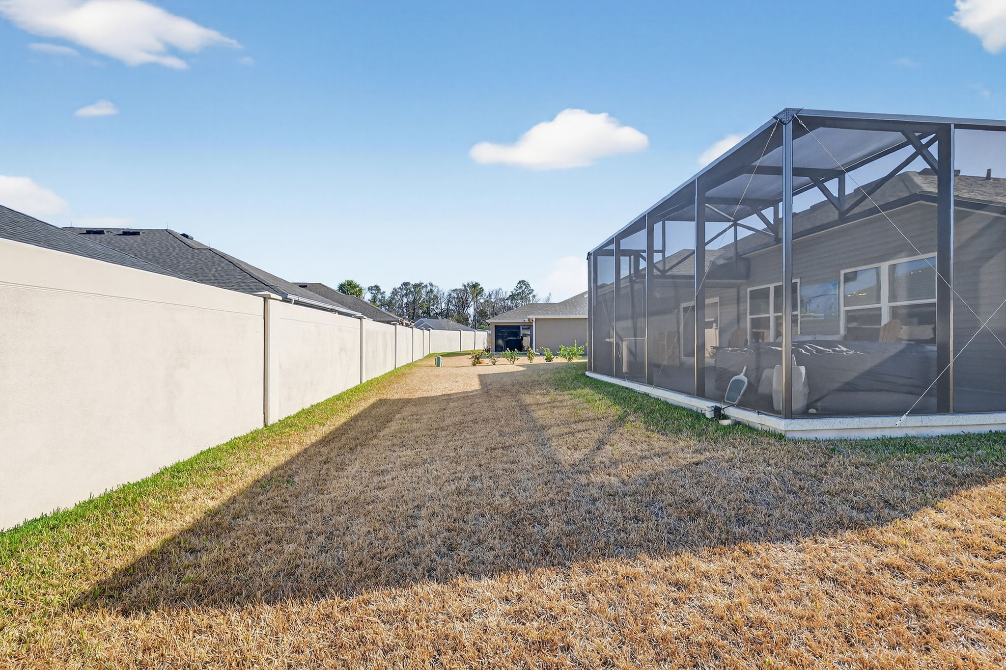 Large Rear Yard with Rear Privacy Wall and Room For a Pool!