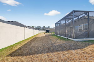 Large Rear Yard with Rear Privacy Wall and Room For a Pool!