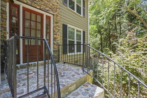 Beautiful wrought iron railing and stone front entry!