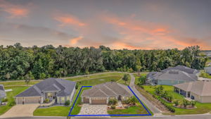 Twilight Aerial Front Elevation with Water Views