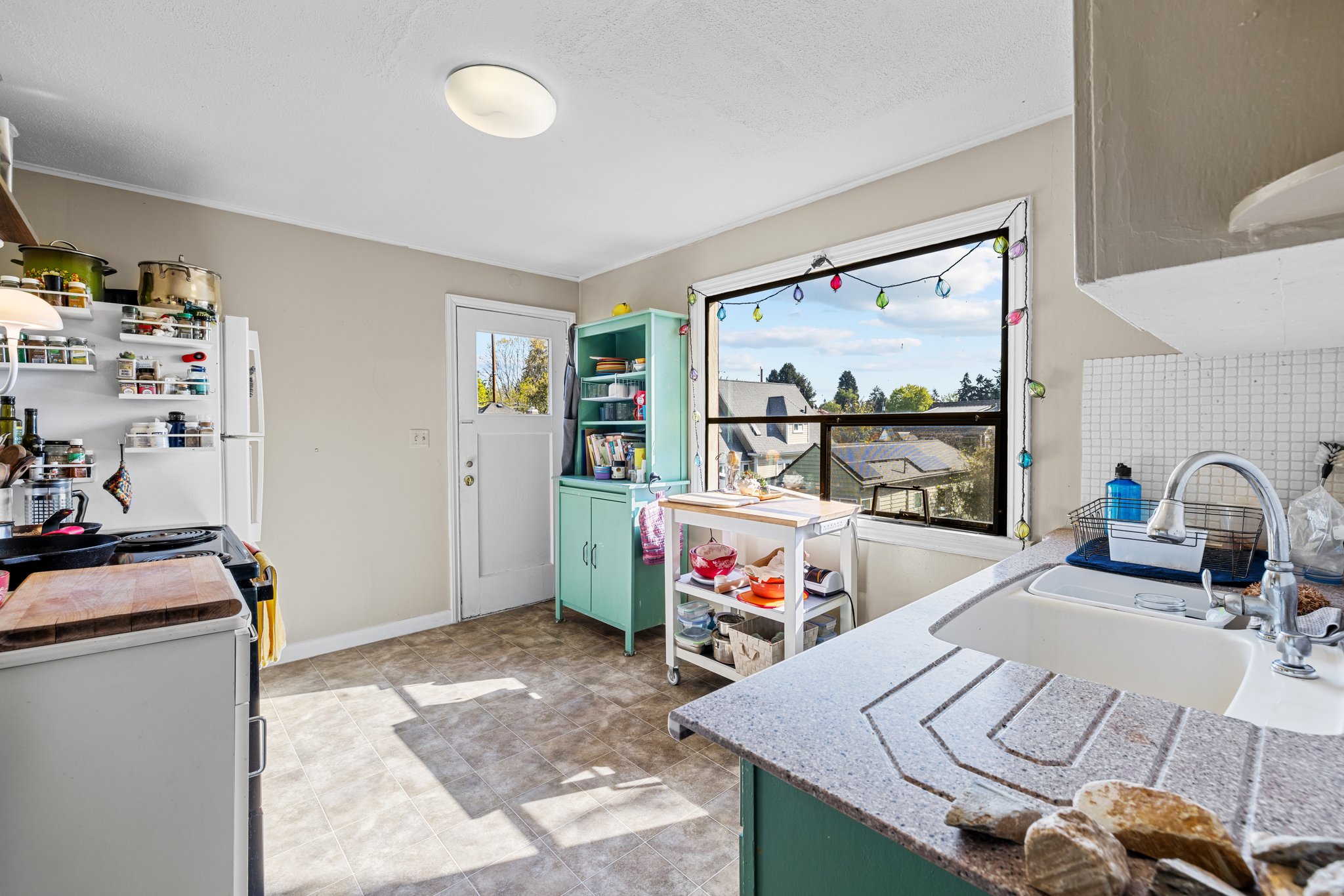 Upper: sunlit kitchen