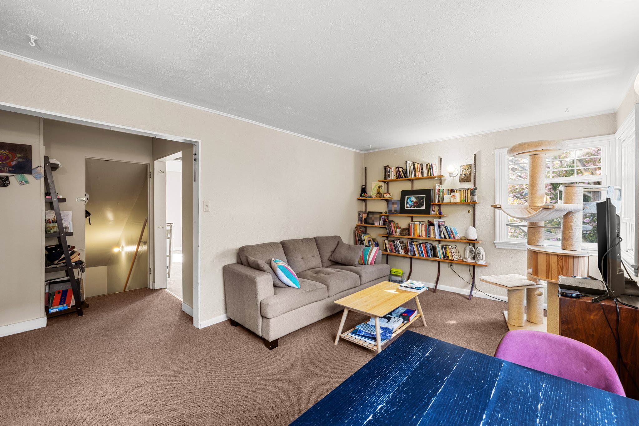Upper: large living room to hallway