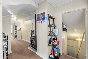 The upper unit is 2 bedroom, 1 bath with a sunroom!  1080 sf