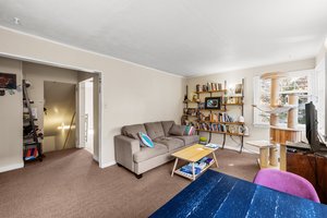 Upper: large living room to hallway
