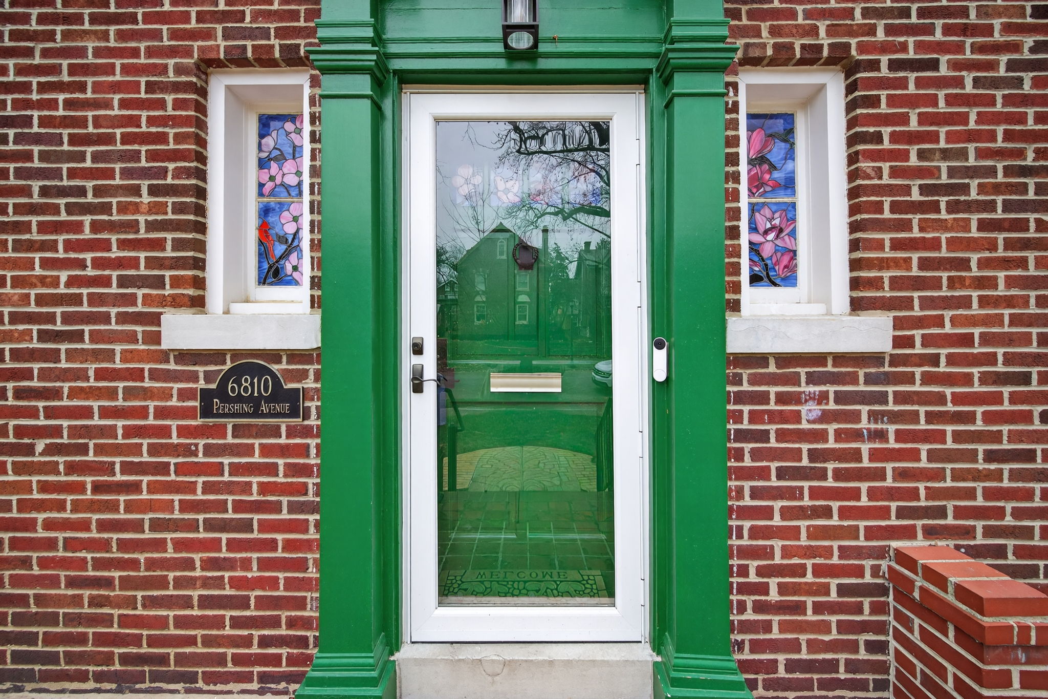 Note the gorgeous magnolia-adorned stained glass windows hand-commissioned and installed by Preston Art Glass to reintroduce old world charm to this fully renovated property.
