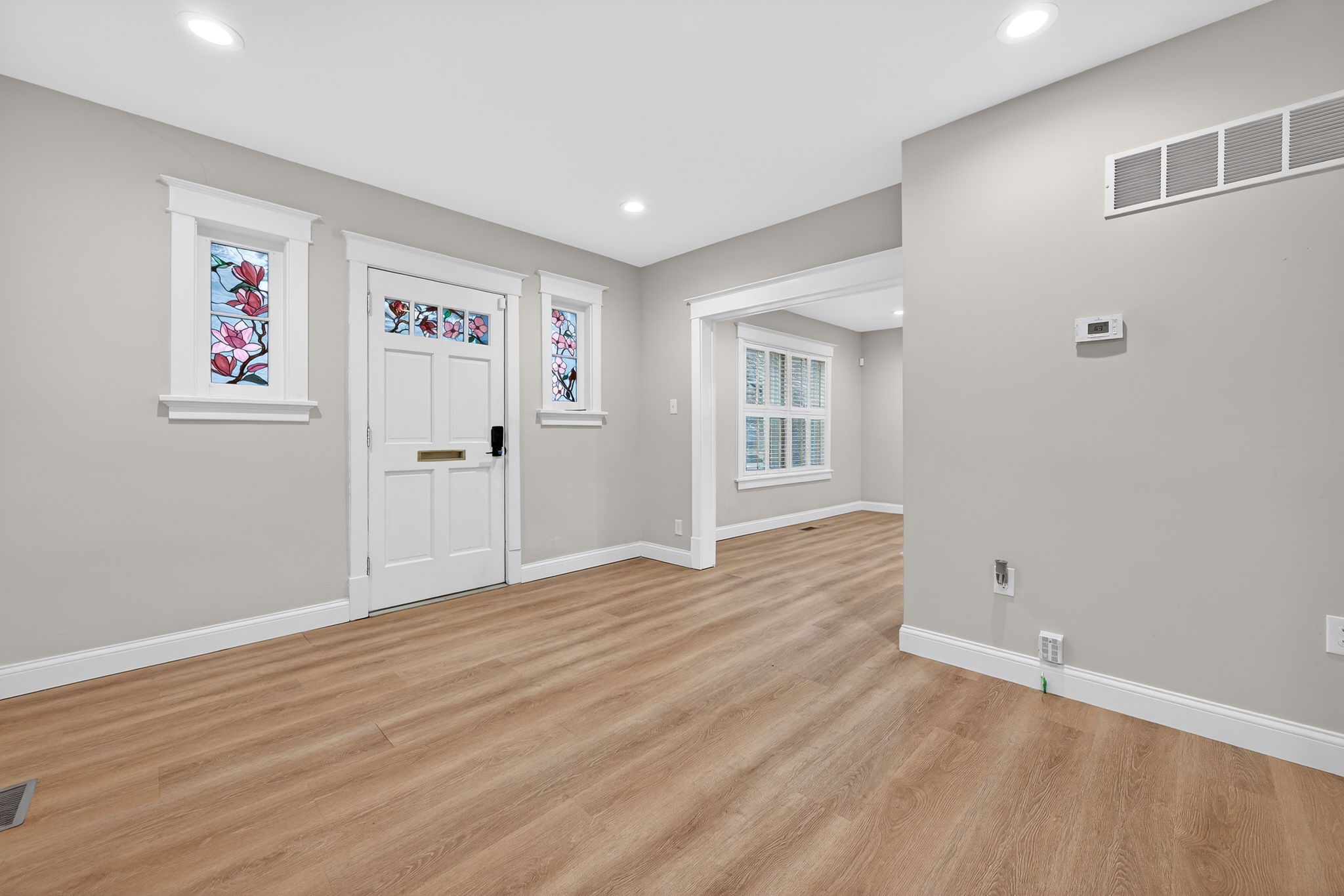 The floorplan is open and airy with a ton of natural light.