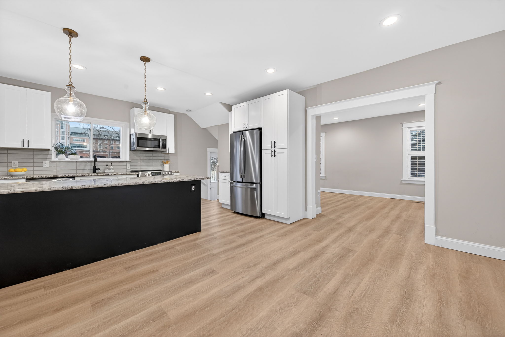 Pull stools up to the island and enjoy the modern layout with a sizable space for a table and entertaining