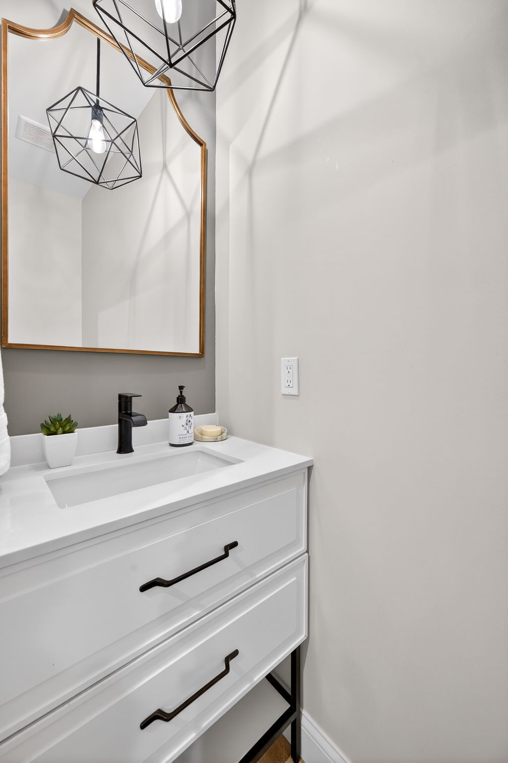 The main floor houses the perfect little powder room for convenience.