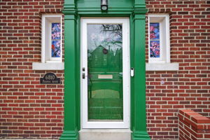 Note the gorgeous magnolia-adorned stained glass windows hand-commissioned and installed by Preston Art Glass to reintroduce old world charm to this fully renovated property.