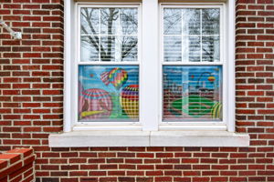 SO SPECIAL! The paintings are only visible from the exterior and do not obstruct or change the inside view. They have become a neighborhood favorite as they burst in StL pride!