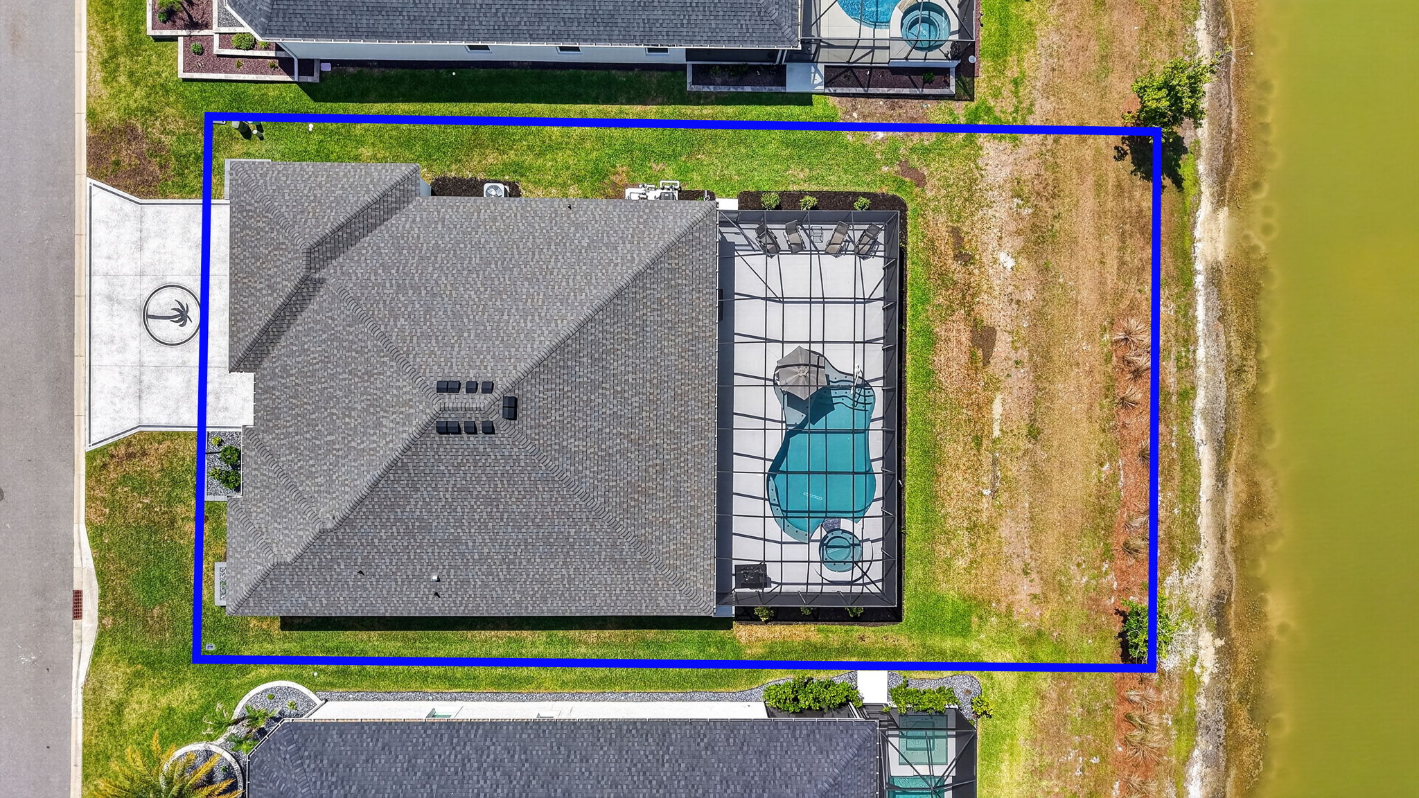 Aerial Side Elevation withProperty Lines, Swimming Pool, Spa, and Water Views