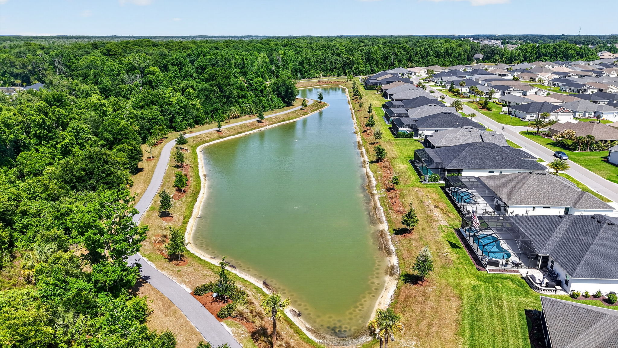 Aerial Side Elevation with Water Views and Walking Trails