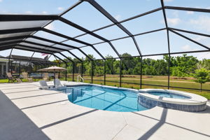 Swimming Pool, Spa, and Screened Porch with Water Views