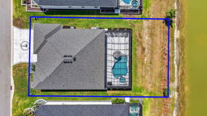 Aerial Side Elevation withProperty Lines, Swimming Pool, Spa, and Water Views