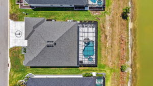 Aerial Side Elevation with Swimming Pool, Spa, and Water Views