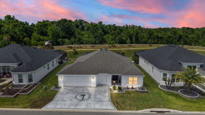 Aerial Twilight  Front Elevation with Water Views