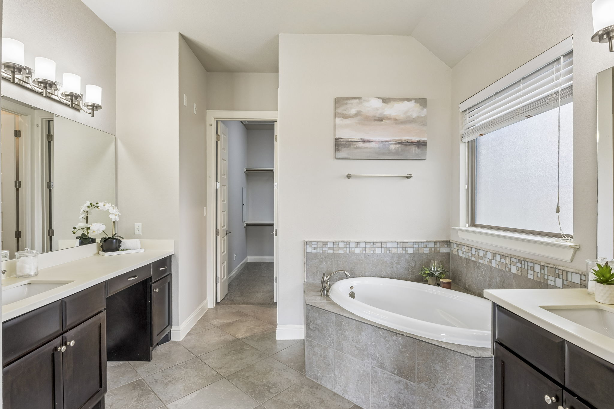 Downstairs Primary Bathroom With Separate Vanities