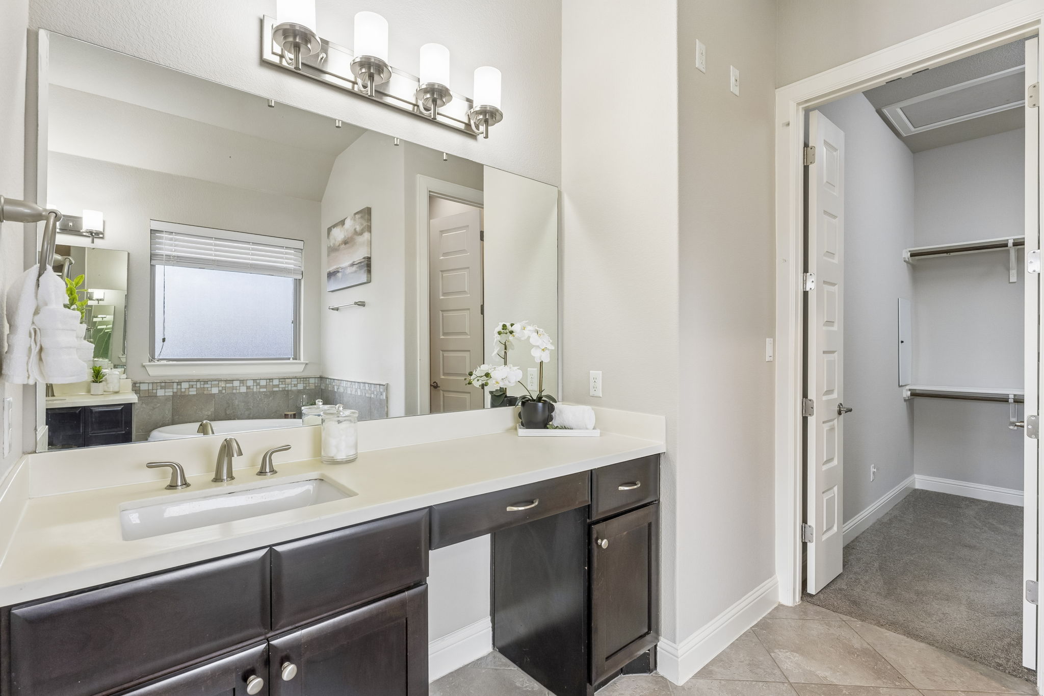 Downstairs Primary Bathroom With Walk-in Closet