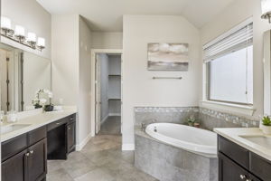 Downstairs Primary Bathroom With Separate Vanities
